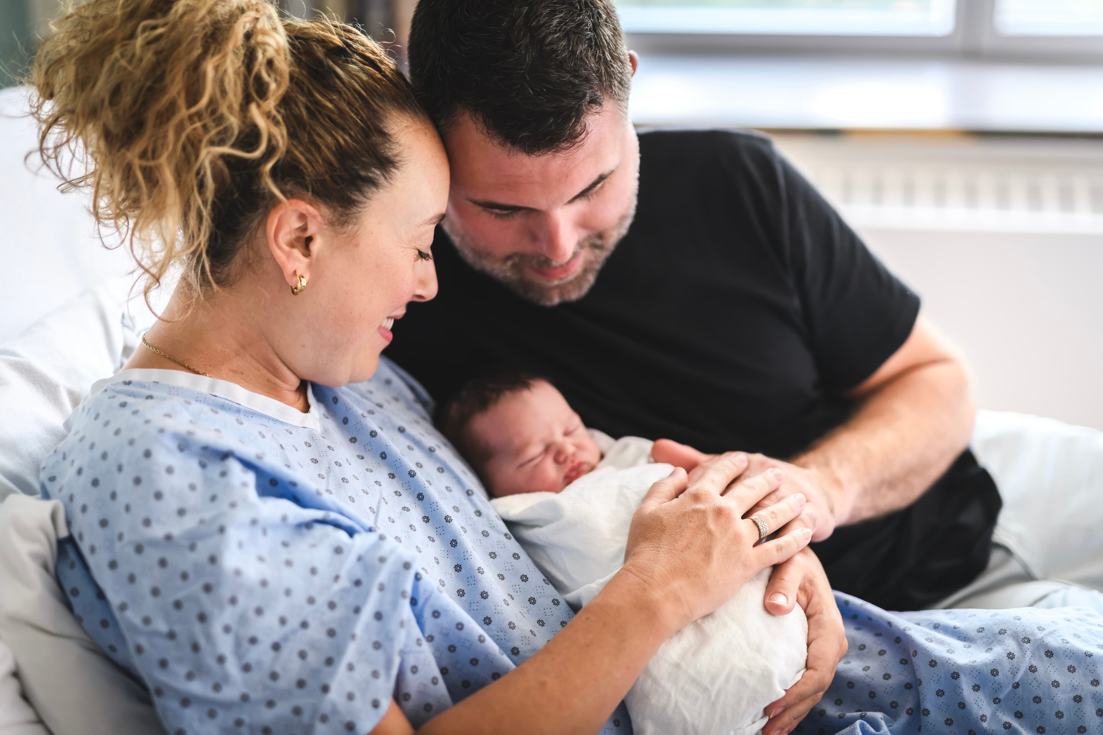 Parents lovingly holding their baby